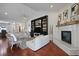 Elegant living room features a fireplace, built-in shelving, and modern decor at 2141 Sandy Point Ln, Mount Pleasant, SC 29466