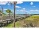 Wooden pier extending over marshland, offering scenic views of the waterfront property at 2141 Sandy Point Ln, Mount Pleasant, SC 29466