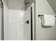 Clean shower with white tiled walls and sleek, black hardware at 2141 Sandy Point Ln, Mount Pleasant, SC 29466