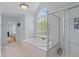 Beautiful bathroom with a garden tub, walk-in shower, and marble tiling at 2184 Tall Grass Cir, Mount Pleasant, SC 29466