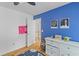 A bright bedroom with blue accent wall and decorative items at 2184 Tall Grass Cir, Mount Pleasant, SC 29466