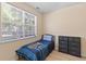 Neutral bedroom with a large window and a comfortable twin bed at 2184 Tall Grass Cir, Mount Pleasant, SC 29466