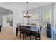 Bright dining room features a modern chandelier and lots of natural light at 2184 Tall Grass Cir, Mount Pleasant, SC 29466