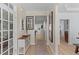 Inviting foyer with light wood floors, decorative accents, and views into the living spaces at 2184 Tall Grass Cir, Mount Pleasant, SC 29466