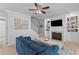 Comfortable living room featuring a fireplace, built-in shelves, and a staircase at 2184 Tall Grass Cir, Mount Pleasant, SC 29466