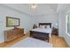 Beautiful main bedroom with hardwood floors, tray ceilings, and a view of the backyard at 2184 Tall Grass Cir, Mount Pleasant, SC 29466