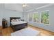 Bright main bedroom featuring a trey ceiling, hardwood floors, and lots of natural light at 2184 Tall Grass Cir, Mount Pleasant, SC 29466
