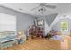 Spacious playroom with wood floors and natural light, perfect for playtime at 2184 Tall Grass Cir, Mount Pleasant, SC 29466