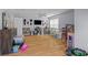 Expansive playroom with wood floors, storage, and lots of room to play at 2184 Tall Grass Cir, Mount Pleasant, SC 29466