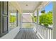 Relax on this peaceful porch with hanging plants, great for outdoor entertaining at 2184 Tall Grass Cir, Mount Pleasant, SC 29466