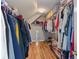 Spacious walk-in closet with hardwood floors and built in shelving at 2184 Tall Grass Cir, Mount Pleasant, SC 29466
