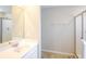 Modern bathroom with vanity, white countertop, framed mirror and stand-up shower at 241 Wathen Dr, Goose Creek, SC 29445
