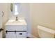 A vanity, sink, faucet, mirror, and toilet are features of this well-lit bathroom at 241 Wathen Dr, Goose Creek, SC 29445