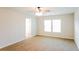 Cozy bedroom featuring neutral walls, plush carpet, and a window providing natural light at 241 Wathen Dr, Goose Creek, SC 29445
