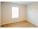 A sunlit bedroom featuring neutral walls and carpet, complemented by a bright window at 241 Wathen Dr, Goose Creek, SC 29445