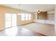 Open-concept living room features sliding glass doors, recessed lighting, and built-in shelving at 241 Wathen Dr, Goose Creek, SC 29445