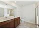 Bright bathroom featuring a double sink vanity with a marble countertop and tiled floors at 278 Catawba Branch Way, Moncks Corner, SC 29461