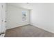 Bedroom featuring neutral carpet, white walls, and a window view at 278 Catawba Branch Way, Moncks Corner, SC 29461