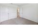 Bedroom with neutral carpet, white walls, an open doorway, and closet at 278 Catawba Branch Way, Moncks Corner, SC 29461