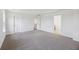 Bright, carpeted bedroom with three doors, creating a peaceful retreat at 278 Catawba Branch Way, Moncks Corner, SC 29461