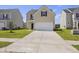 Inviting two-story home featuring a classic design, a two-car garage, and a well-manicured lawn at 278 Catawba Branch Way, Moncks Corner, SC 29461