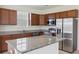 Modern kitchen featuring stainless steel appliances, granite countertops, and ample cabinet space at 278 Catawba Branch Way, Moncks Corner, SC 29461