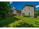 Spacious backyard featuring lush green grass, fencing, and the rear of the house at 286 Chemistry Cir, Ladson, SC 29456