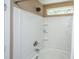 A bathtub and shower with white tiles and a shower curtain and head at 286 Chemistry Cir, Ladson, SC 29456