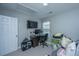 A bedroom with a computer, television, and organized storage at 286 Chemistry Cir, Ladson, SC 29456