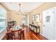 Cozy dining room features a wooden table set for eight, next to console table at 286 Chemistry Cir, Ladson, SC 29456