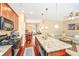 Bright, open-concept living space featuring a kitchen island, cozy living area, and elegant dining set at 286 Chemistry Cir, Ladson, SC 29456