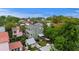 Aerial view of charming neighborhood, highlighting home's backyard with hot tub and lounge area at 29 Bogard St, Charleston, SC 29403