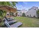 Spacious backyard with lounge chairs, a barrel sauna, and well-maintained lawn at 29 Bogard St, Charleston, SC 29403