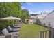 Lush backyard with a barrel sauna, outdoor fireplace, and manicured landscaping at 29 Bogard St, Charleston, SC 29403
