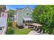 Backyard features a hot tub, patio with awning, lounge furniture, and a well-maintained lawn at 29 Bogard St, Charleston, SC 29403