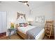 Bedroom with a natural theme, white walls, bright natural light, and hardwood floors at 29 Bogard St, Charleston, SC 29403