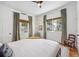 Bedroom with two windows bringing in natural light, complemented by neutral curtains and a queen-sized bed at 29 Bogard St, Charleston, SC 29403