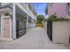 Open driveway next to a two-story house, featuring a gated entrance for privacy at 29 Bogard St, Charleston, SC 29403