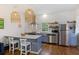 Bright kitchen with stainless appliances, quartz countertops, and stylish pendant lighting at 29 Bogard St, Charleston, SC 29403