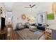 Open living room with hardwood floors, ceiling fan, and an inviting seating arrangement at 29 Bogard St, Charleston, SC 29403