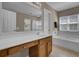 Bathroom featuring a dual vanity with soaking tub and glass shower at 30 Regency Oaks Dr, Summerville, SC 29485