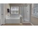 Bathroom featuring a separate shower and soaking tub with natural light at 30 Regency Oaks Dr, Summerville, SC 29485
