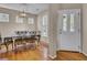 Bright dining room with hardwood floors, large windows, and a decorative chandelier at 30 Regency Oaks Dr, Summerville, SC 29485