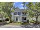 Beautiful two-story home with double balconies, manicured landscaping, and a welcoming front porch at 30 Regency Oaks Dr, Summerville, SC 29485