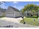 Charming home exterior with well-manicured lawn, attached garage, and picturesque landscaping for curb appeal at 30 Regency Oaks Dr, Summerville, SC 29485