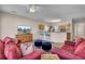 Cozy living room with a TV, bar seating, and an open layout connecting to the kitchen at 30 Regency Oaks Dr, Summerville, SC 29485