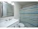 Clean bathroom featuring a vanity with a mirror, a toilet, and a shower with a striped curtain at 306 Crestview Dr # C, Summerville, SC 29485