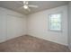 Cozy bedroom with neutral walls, carpet flooring, closet for storage, and a window for natural light at 306 Crestview Dr # C, Summerville, SC 29485