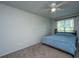 Cozy bedroom with carpet flooring, ceiling fan, and natural light from the window at 306 Crestview Dr # C, Summerville, SC 29485