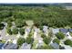 Aerial view of the home in a neighborhood with mature trees and a private pool at 3073 Penny Ln, Johns Island, SC 29455